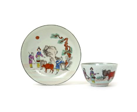 A Worcester teabowl and saucer  c.1755-60, printed and coloured with the Red Bull pattern, with Chinese figures standing arou