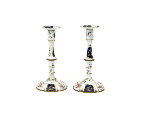 A pair of South Staffordshire enamel candlesticks  c.1770, the knopped forms painted with polychrome flower sprays between sh