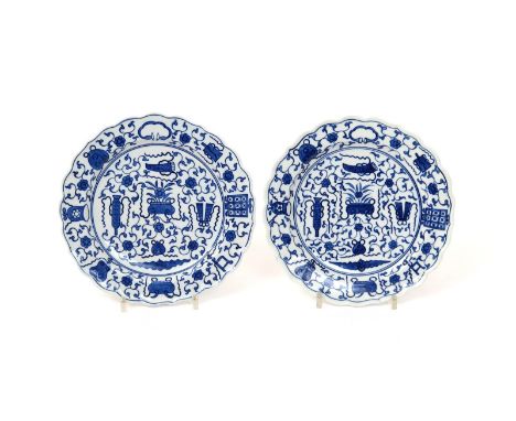 A pair of Worcester blue and white dessert plates  c.1770-80, painted with the Hundred Antiques pattern, with central censers