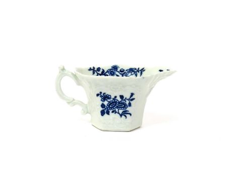 A Worcester blue and white creamboat  c.1757-60, of hexagonal form, moulded with a geranium leaf to the spout, printed with t