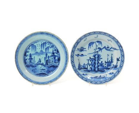 Two delftware plates  mid 18th century, one unusually painted in blue with a willow tree issuing from a stack of rocks beside