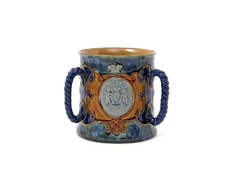 A Royal Doulton commemorative tyg  c.1905, the generous cylindrical body applied with three rope handles, one side moulded wi