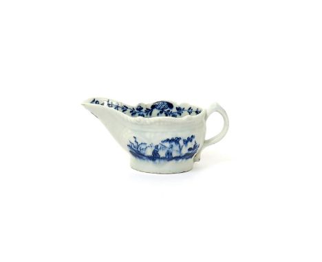 A Lowestoft blue and white creamboat  c.1775, moulded with arcaded panels and painted with the Two Porter Landscape pattern, 