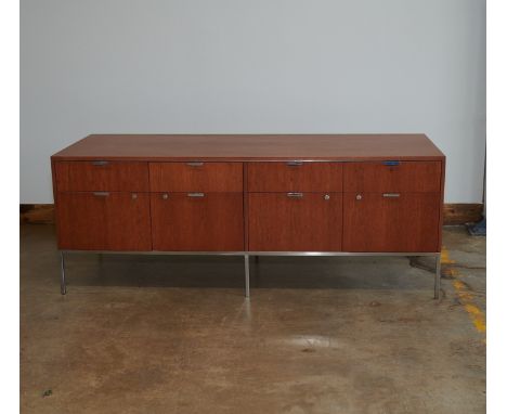 Dunbar, United States. Mid-century modern teak and walnut credenza with chrome fittings. With eight drawers, four with locks.