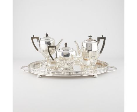 Edwardian English silver service set. The three kettles, creamer, and sugar bowl are sterling silver and the large tray is si