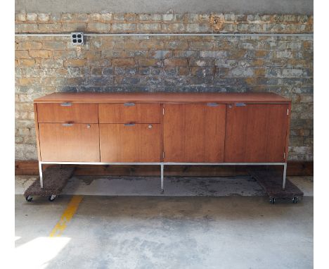 Dunbar, United States. Mid-century modern teak and walnut credenza with chrome fittings. With four drawers, two with locks. T