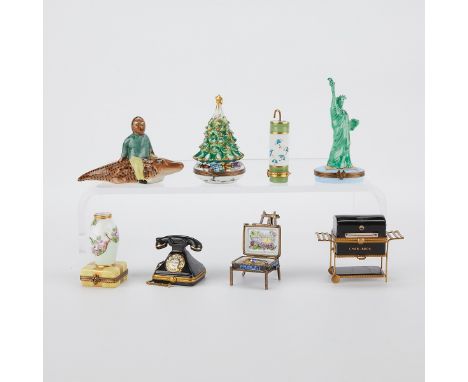 Limoges, France. Group of seven porcelain trinket or pill boxes and one figurine. All seven boxes are marked along the unders