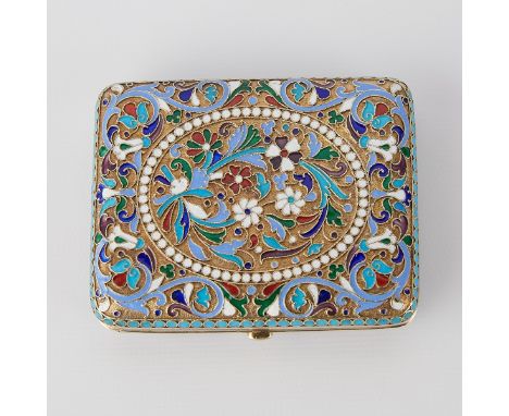 Russian silver enamel inlaid cigarette case with a push button closure. Decorated throughout with scrollwork, an oval beaded 