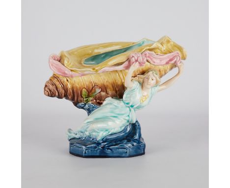 Porcelain centerpiece depicting a woman holding aloft a large shell. Possibly Royal Dux, Bohemia, Austria. Impressed along th