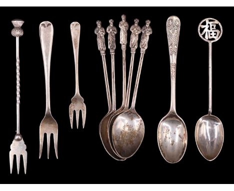 A small quantity of silver and white metal spoons and forks, including a pickle fork, apostle, and Chinese calligraphic termi
