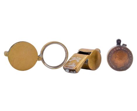 The Acme Thunderer brass snail whistle together with a folding magnifying glass and a trench art-style penny coin cigarette l