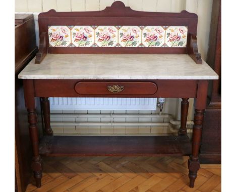 A Victorian mahogany marble top washstand, having a transfer decorated tile back, 107 x 50 x 109 cm