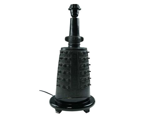 A late 20th Century patinated cast brass and ebonised wood table lamp in the form of a Chinese temple bell, height 52 cm