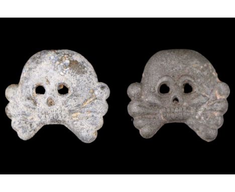 A pair of German Third Reich Army Panzer zinc tunic collar patch skulls