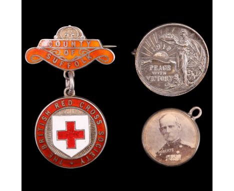 An 1899 Boer War Lord Roberts and Colonel Baden Powel silver-mounted fob medallion, a 1911 British Red Cross Society County o