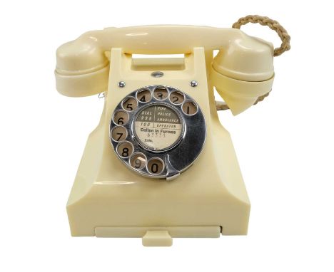 A 1940s / 1950s GPO 300 series ivory Bakelite rotary dial telephone with drawer, base marked 5677