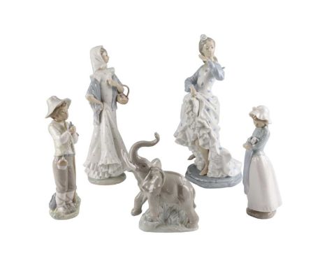 A group of NAO figurines comprising a large dancer, a woman, two children and an elephant, tallest 35 cm