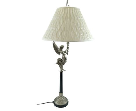 A contemporary table lamp modeled as a mythological winged figure, 100 cm overall