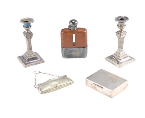 A quantity of electroplate comprising a pair of neo-classical candlesticks, an engine-turned hinge-lidded box, a leather-cove
