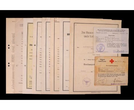 German Third Reich award citations and documents comprising a 4 year armed forces long service medal, 1st October entry into 