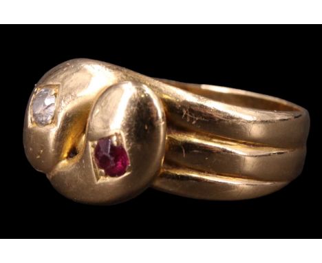 A late Victorian diamond and ruby entwined "serpents" finger ring, having reeded shoulders terminating in adorsed or boteh-li