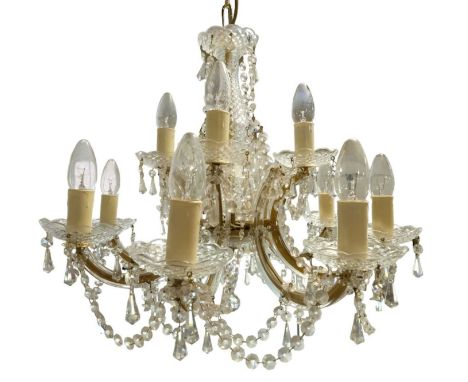 A late 20th Century12 branch crystal chandelier, having two tiers of four over eight branches, 56 x 46 cm including suspensio