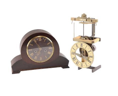 A novelty single pointer table clock, the escapement comprising a rotating arm swinging a ball and chain, which wraps and unw