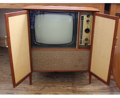 A vintage Decca TV in striking stylish cabinet.  This item is sold as a Collectors item only and has not been subject to an e