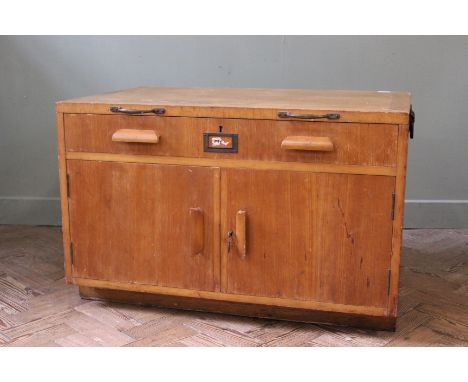 A substantial vintage shop unit with two door cupboard below a single drawer 