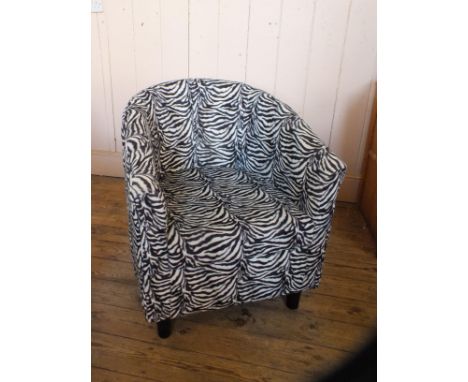 A faux zebra fur print armchair