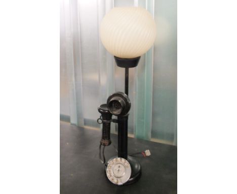 An unusual 1920's stick telephone with lamp attached to base.  This item is sold as a Collectors item only and has not been s