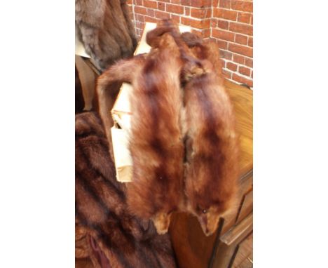 A collection of vintage lady's fur coats and an evening stole