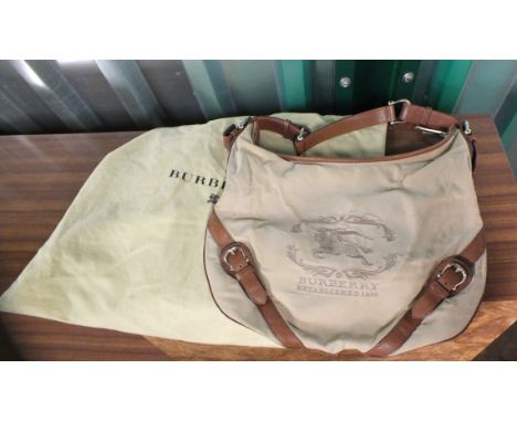 A vintage Burberry canvas and tan leather handbag with original outer bag