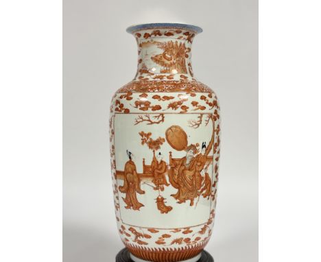 A large Chinese porcelain baluster vase decorated in an iron red palette, probably c. 1900, the body painted with twin figura