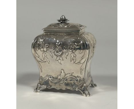 An early George III silver tea caddy, Emick Romer, London 1767, of rectangular bombe form, the lift-off cover with foliate kn
