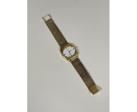 An 18ct gold vintage gentleman's wristwatch, Victor 17 Incabloc, the white enamel dial with baton numerals, in a cushion case