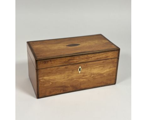 A George III inlaid satinwood tea caddy, c. 1800, of plain oblong form, the hinged cover with lozenge-shaped rosewood panel a