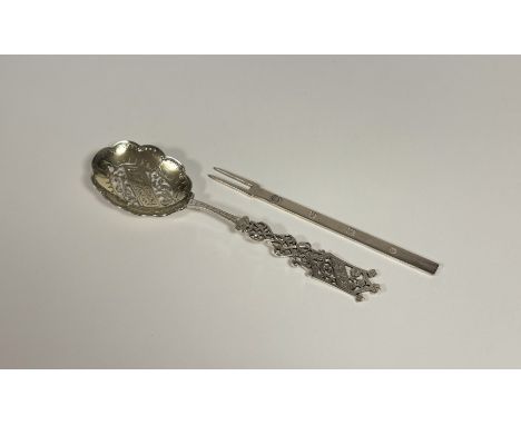 A late Victorian silver serving spoon, Harrison Brothers &amp; Howson, Sheffield 1889, with elaborately pierced and engraved 