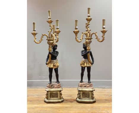 A pair of parcel-gilt figural four-light candelabra table lamps in the Venetian taste, modern, each modelled with a standing 