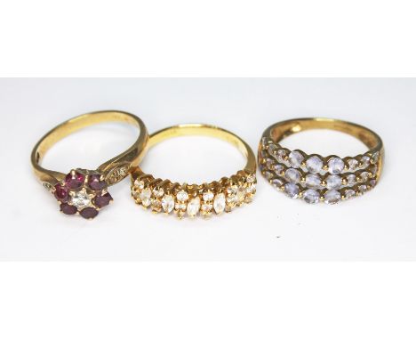 A group of three rings comprising a CZ cluster ring marked '18Kt' wt. 3.8g and two hallmarked 9ct gold cluster rings, wt. 5g,