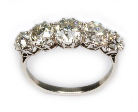 An antique five stone diamond ring, the old cut stones weighing approx. 0.31, 0.62, 0.83, 0.61 &amp; 0.30cts, total approx. d