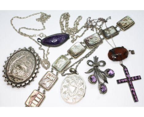 A mixed lot of silver and white metal jewellery comiprising two white metal locket pendants on chains, a mother of pearl came