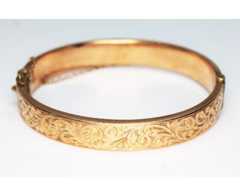 A hallmarked 9ct gold bangle, also marked 'Wax Filled', gross wt. 17.2g.  