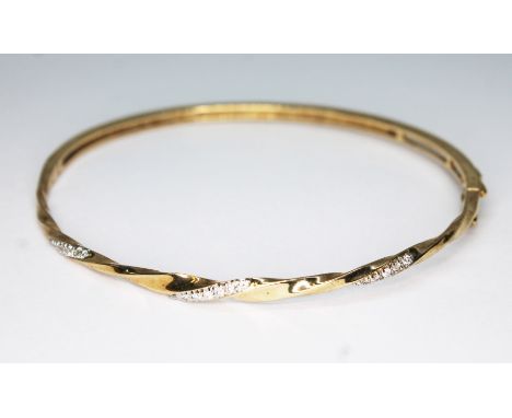A hallmarked 9ct gold diamond bangle, diameter approx. 5.5cm, wt. 8.2g.  