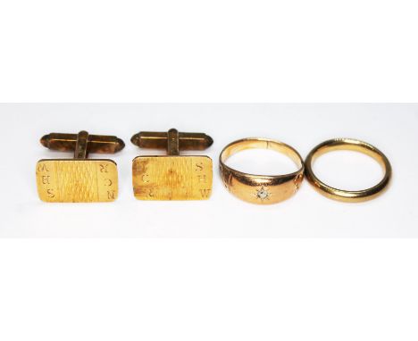 A mixed lot comprising a pair of hallmarked 9ct gold cufflinks, a hallmarked 9ct gold wedding band and a ring unmarked, gross