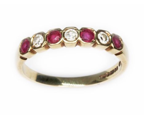 A diamond and ruby ring, hallmarked 9ct gold, sponsor 'ST', Sheffield 1993, gross wt. 2g, size O/P.  