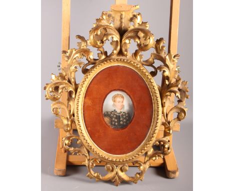 After Hilliard: a miniature portrait of Mary Queen of Scots, in Florentine carved giltwood frame (damages to frame), 17" x 14