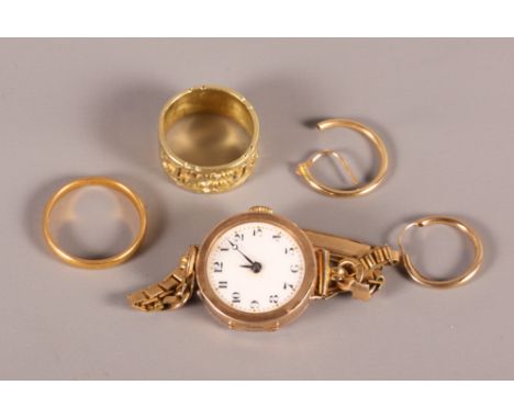 An Eastern gold ring, 7.7g, a 22ct gold wedding band, 4.2g, two 9ct gold hoop earrings, 1.3g, and a 9ct gold cased ladies wri