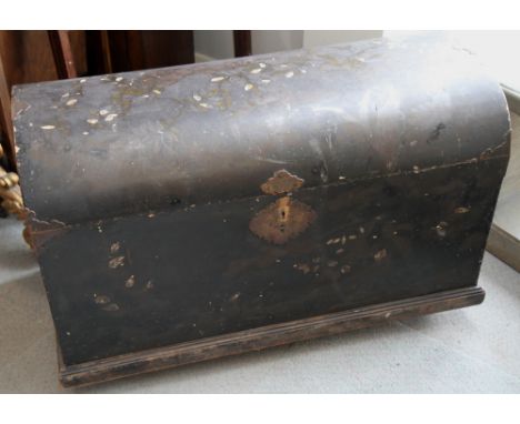 A Japanese black lacquered dome top wooden trunk decorated foliage, engraved brass mounts, on castors, 37" wide