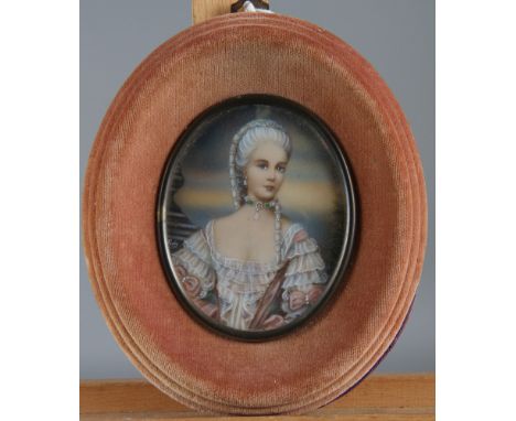 A portrait miniature on ivory, elegant woman, signed Ruby?, in oval velvet frame